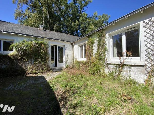 Maison de plain-pied avec dépendances à rafraichir