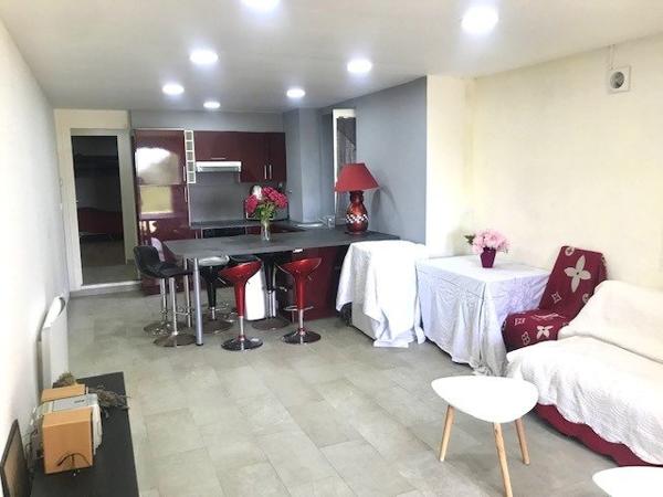 Appartement trois pièces en rez-de-jardin 