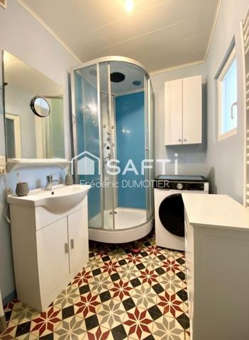 Maison habitable de plain-pied avec garage et jardin