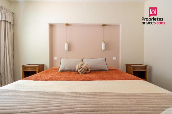 Maison de plain-pied sur un terrain boisé sans vis-à-vis