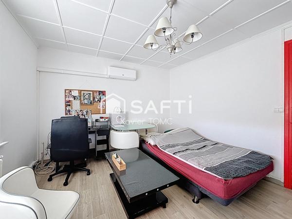 MAISON A USAGE MIXTE