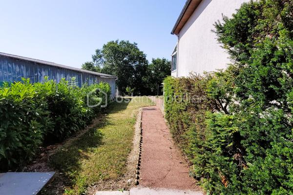 Dans la commune nouvelle recherchée de Cloyes-les-trois-Rivières, cette jolie maison se trouve à Montigny-le-Gannelon, en surplomb du lac de Cloyes. Entre ville et campagne et dans un quartier très calme, l'accès est direct au-centre ville par des escaliers et par la route.
Ce bien bénéficie d'une belle superficie de terrain légèrement en pente que vous pourrez planter à votre goût, entièrement clôturé avec portail.
L'avant de la maison bénéficie d'une belle cour spacieuse avec garage supplémentaire et plate-bandes.

La maison offre une surface habitable de 69 m², avec une surface utile de 34 m² supplémentaires grâce une grande véranda et une chambre au sous-sol. S'y ajoutent le sous-sol total composé en plusieurs espaces, un garage supplémentaire et un abri de jardin.

Au-dessus d'un sous-sol total, l'habitation de plain-pied comprend : 
  - un séjour lumineux,
  - deux chambres (12,5 m² chacune),
  - une cuisine fermée,
  - une entrée-couloir avec placards,
  - une salle d'eau,
  - des WC séparés.

Le sous-sol est doté de plusieurs espaces distincts et accès à l'étage et à l'extérieur :
  - Atelier -cuisine d'été, 
  - pièce de stockage,
  - Espace avec placards,
  - garage,
  - chambre aménagée (10 m²) avec son propre point d'eau

Une véranda de 24 m² est munie de stores, de 2 portes vitrées, fenêtres et d'un plafond opaque, donnant directement sur le jardin.
Un garage supplémentaire avec porte motorisée et un abri de jardin complètent ce bien.

++ LES PLUS ++ :
  - De nombreuses portes vitrées donnent beaucoup de lumière à cette maison.
  - L'ensemble est chauffé par une chaudière fioul récente (4 ans), une pompe à chaleur réversible multisplit à remettre en fonction, et une cheminée à insert.
  - Menuiseries : PVC double-vitrage et bois double-vitrage, porte d'entrée PVC grande largeur vitrée récente.
  - Isolation extérieure des murs
  - VMC double-flux
  - Volets roulants PVC électriques et manuels.
  - Raccordé fibre

Assainissement non collectif : bac de dégraissage et fosse toutes eaux.
Contactez-moi rapidement pour saisir cette opportunité !
  .