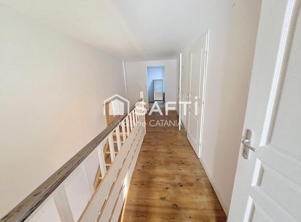 Tullins - Maison mitoyenne de 120m² habitables avec grand garage, cour.