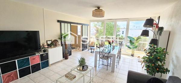 Secteur Gare : Appartement de 98m² avec 3 chambres, balcon, cave et garage.