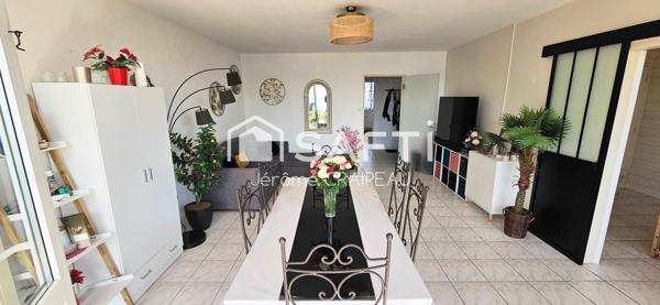 Secteur Gare : Appartement de 98m² avec 3 chambres, balcon, cave et garage.