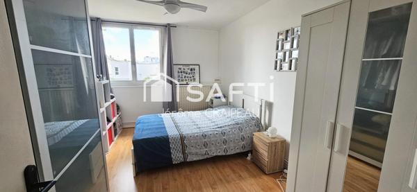 Secteur Gare : Appartement de 98m² avec 3 chambres, balcon, cave et garage.