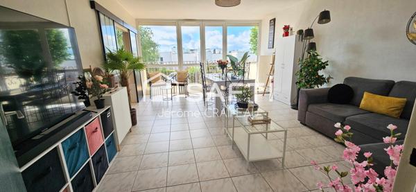 Secteur Gare : Appartement de 98m² avec 3 chambres, balcon, cave et garage.