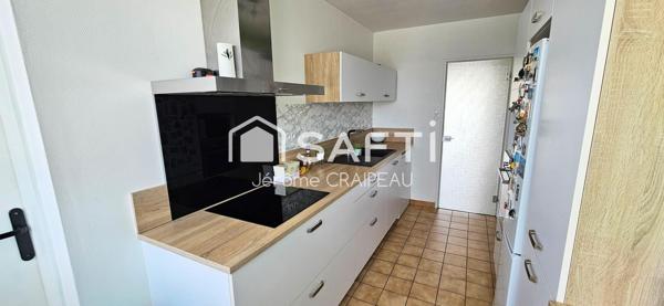 Secteur Gare : Appartement de 98m² avec 3 chambres, balcon, cave et garage.