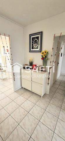 Secteur Gare : Appartement de 98m² avec 3 chambres, balcon, cave et garage.