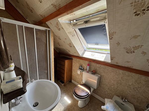 A vendre centre d'AMBON, maison individuelle avec garage et terrain clos de 602 m²