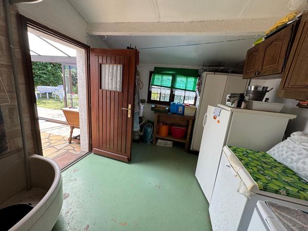 A vendre centre d'AMBON, maison individuelle avec garage et terrain clos de 602 m²