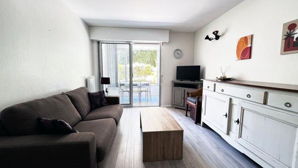 Appartement proche plage et commerces avec garage véranda et jardinet