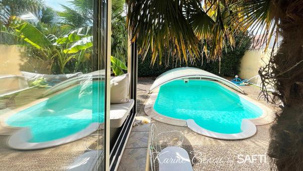 Un havre de paix aux allures de "maison de vacances" : piscine, jardin paysager et atmosphère zen