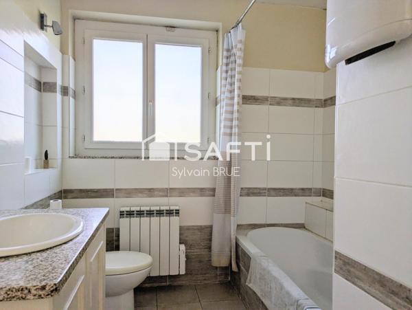 Maison avec jardin, garage et sous sol complet