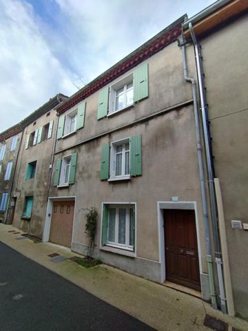 Maison de ville avec garage et jardin à quelques pas du centre ville