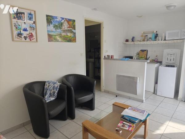 Ensemble immobilier composé de trois logements, garage et local technique