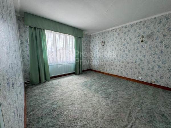 Maison individuelle semi plain-pied avec vue dégagée - Beau potentiel