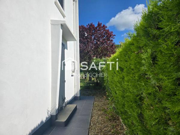 Idéalement située, proche commodités avec jardin et garage