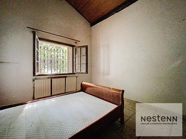 A vendre maison en pierre de 225 m² avec 7 chambres sur terrain arboré de 530 m² à Montpellier