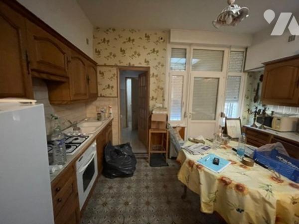 UNE MAISON A USAGE D'HABITATION