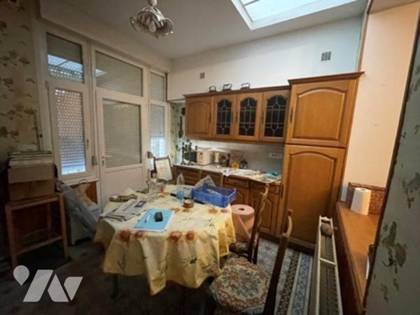 UNE MAISON A USAGE D'HABITATION