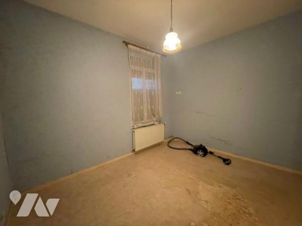 UNE MAISON A USAGE D'HABITATION