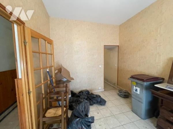 UNE MAISON A USAGE D'HABITATION