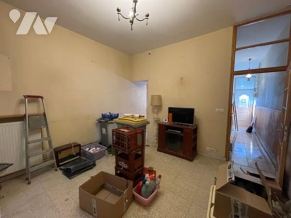 UNE MAISON A USAGE D'HABITATION