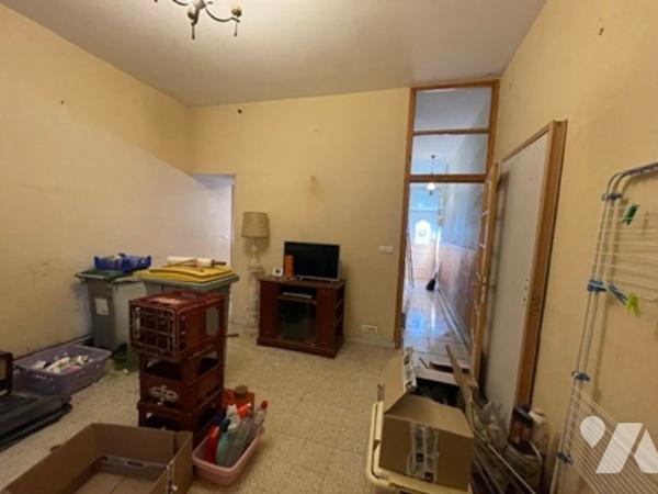 UNE MAISON A USAGE D'HABITATION