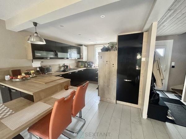 MAISON COUP DE COEUR  AVEC GARAGE.
