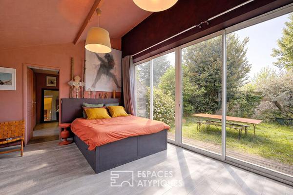 Maison de caractère revisitée avec double jardin et volumes de vie ouverts