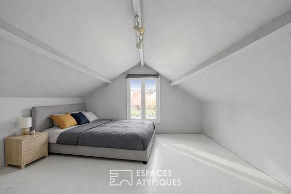 Maison de caractère revisitée avec double jardin et volumes de vie ouverts