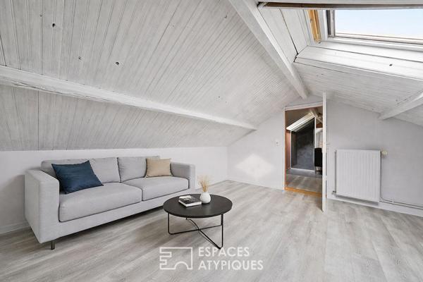 Maison de caractère revisitée avec double jardin et volumes de vie ouverts
