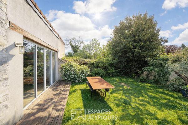 Maison de caractère revisitée avec double jardin et volumes de vie ouverts
