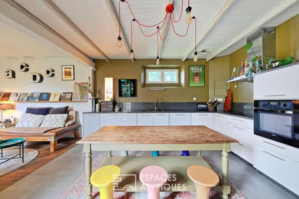 Maison de caractère revisitée avec double jardin et volumes de vie ouverts