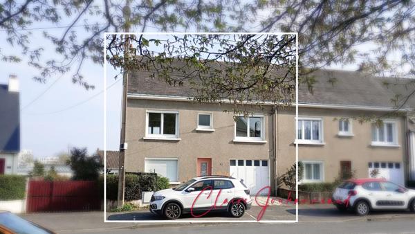 Maison  à fort potentiel avec jardin et grand garage -