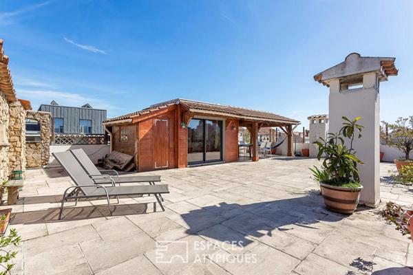 Appartement rénové en dernier étage avec une terrasse plein ciel de 122m2