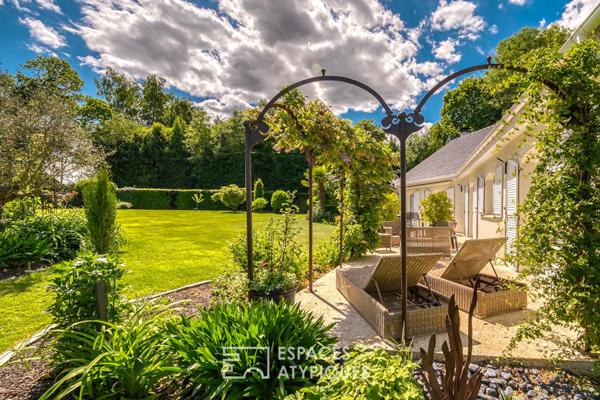 Élégante maison de plain-pied avec jardin paysager et double garage