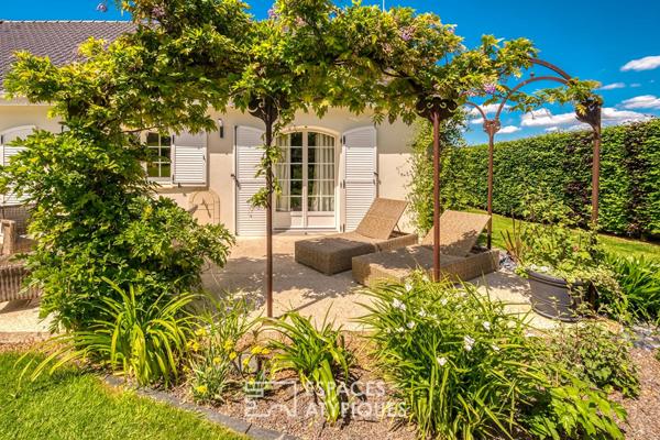 Élégante maison de plain-pied avec jardin paysager et double garage