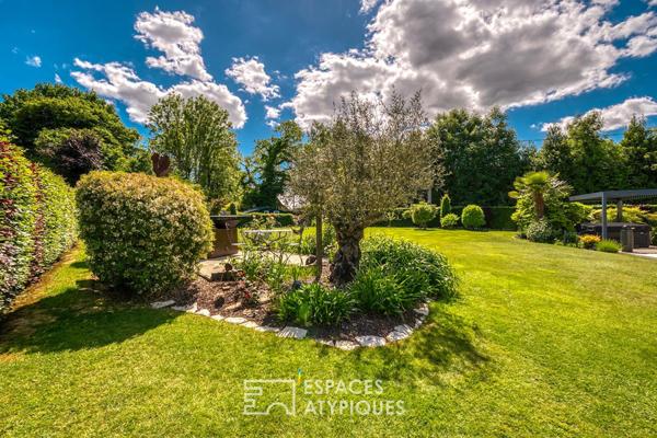 Élégante maison de plain-pied avec jardin paysager et double garage