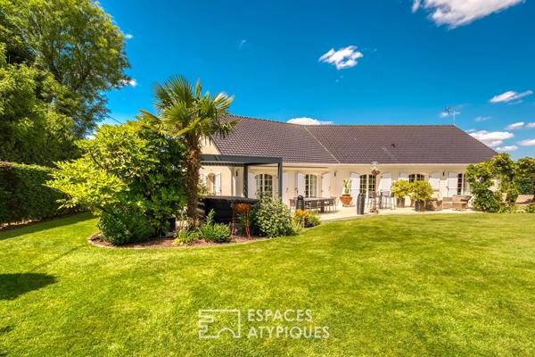 Élégante maison de plain-pied avec jardin paysager et double garage