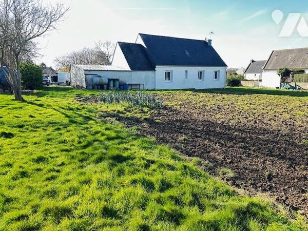 Maison avec grand terrain en zone constructible