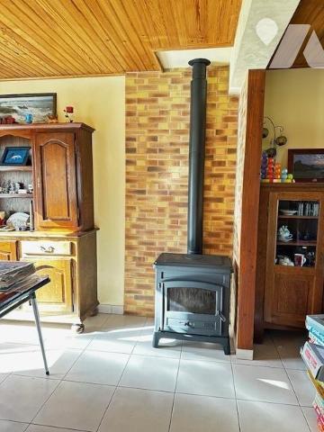 Maison avec grand terrain en zone constructible