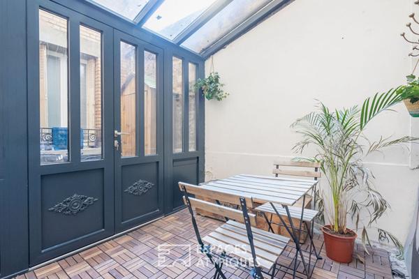 Appartement bourgeois avec véranda face au parc des Buttes Chaumont