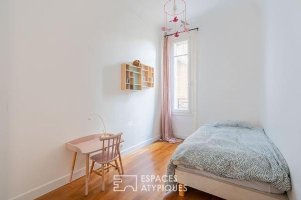 Appartement bourgeois avec véranda face au parc des Buttes Chaumont