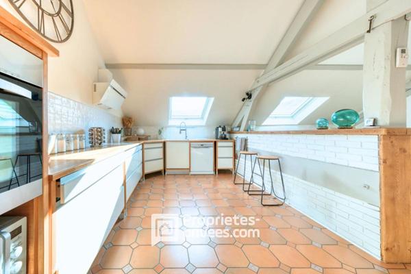 Bien de caractère et sa pièce de vie façon Loft