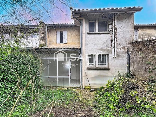 Idéalement situé en centre-ville : 3 chambres, 2 salle des de bains et jardin.