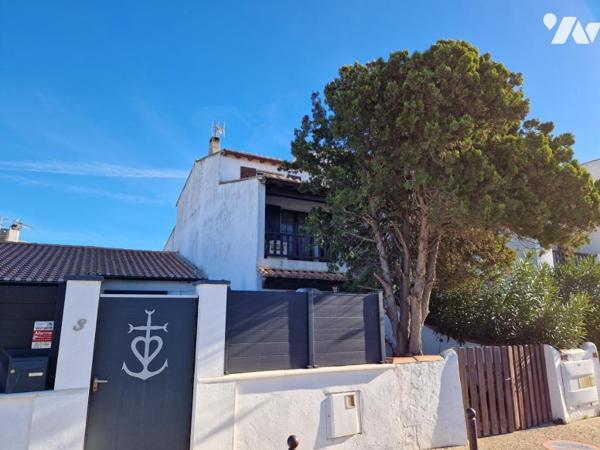 Maison de ville avec cours et balcons