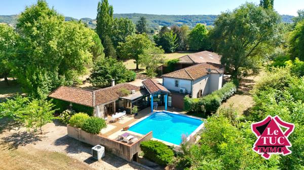 Propriété en pierre avec 2 hectares de parc au bord du Lot avec grange et piscine. Penne-d'Agenais (47140)