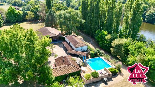 Propriété en pierre avec 2 hectares de parc au bord du Lot avec grange et piscine. Penne-d'Agenais (47140)